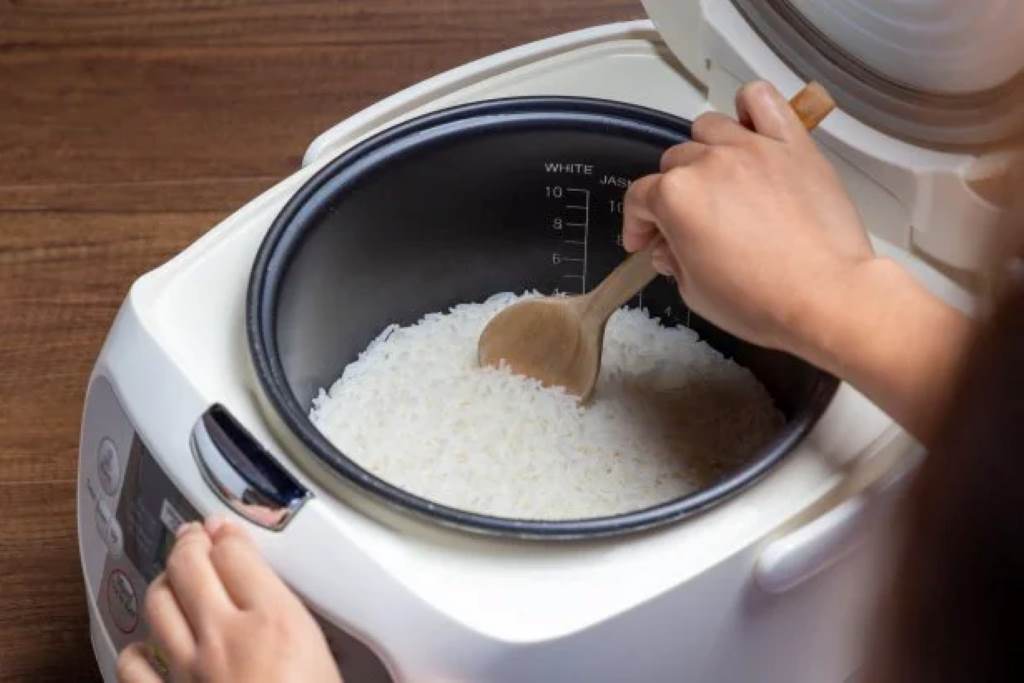 Portable electric kettle boiling water for tea in cozy home setting