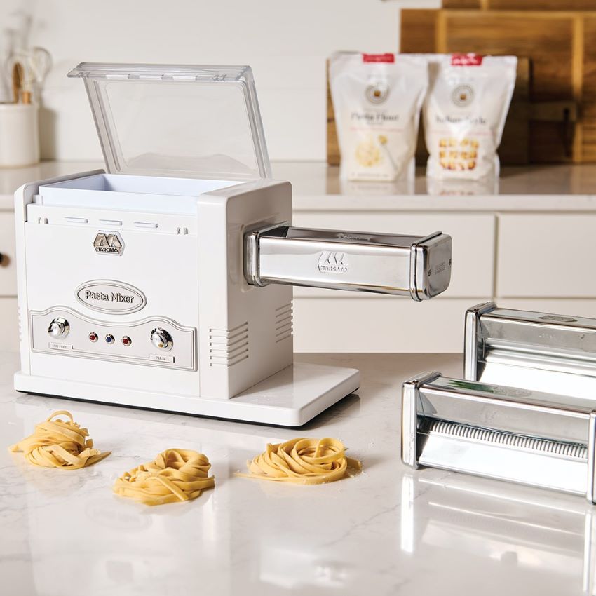 Fresh pasta being made using MARCATO electric pasta maker with Atlas and Ampia accessories.