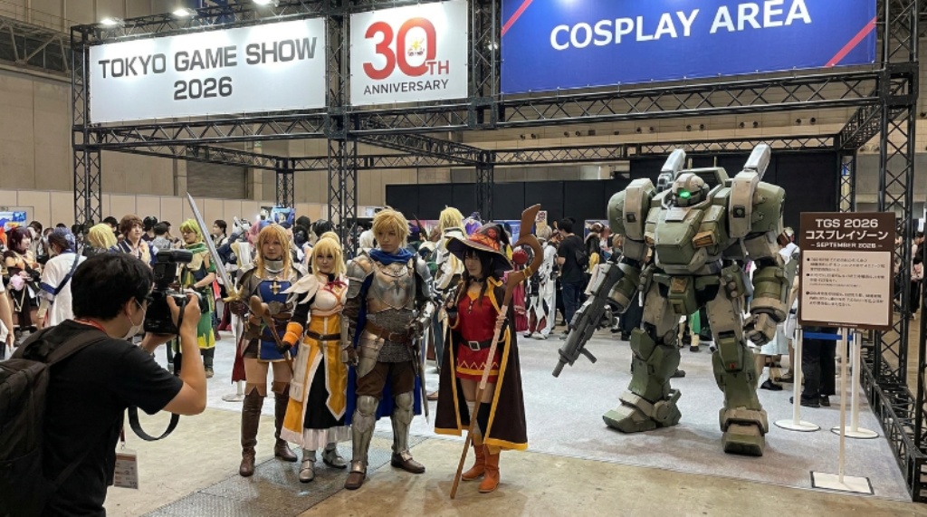 Cosplayers in elaborate video game costumes posing in the dedicated cosplay area at Tokyo Game Show 2026 in Chiba, Japan, during the 30th anniversary event